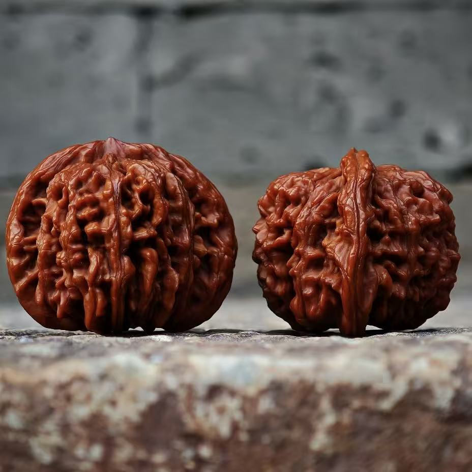 Four Towers Wenwan walnut pair with flowing ridges and structured base